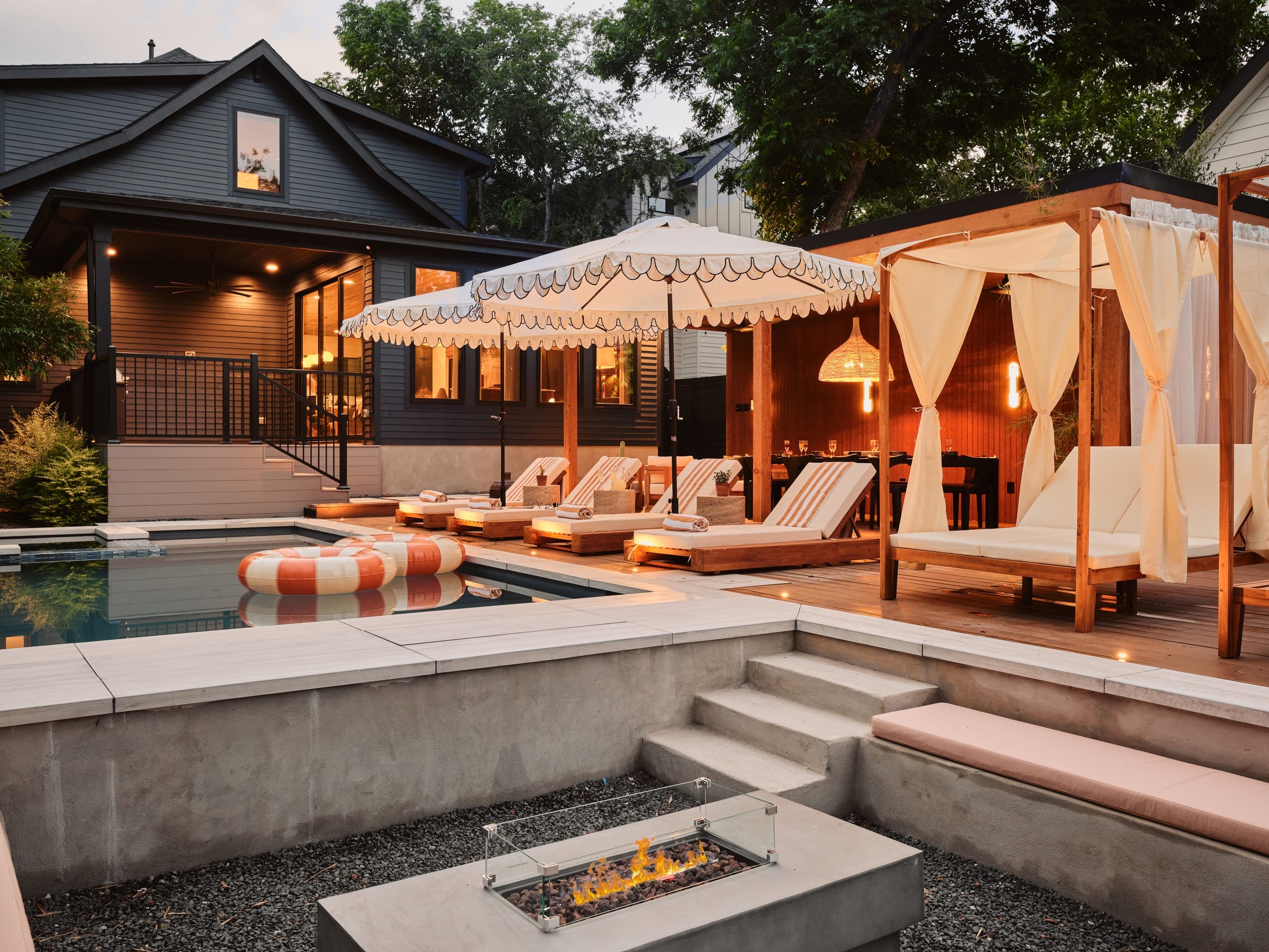The sunken fire pit lounge with loungers and daybed
