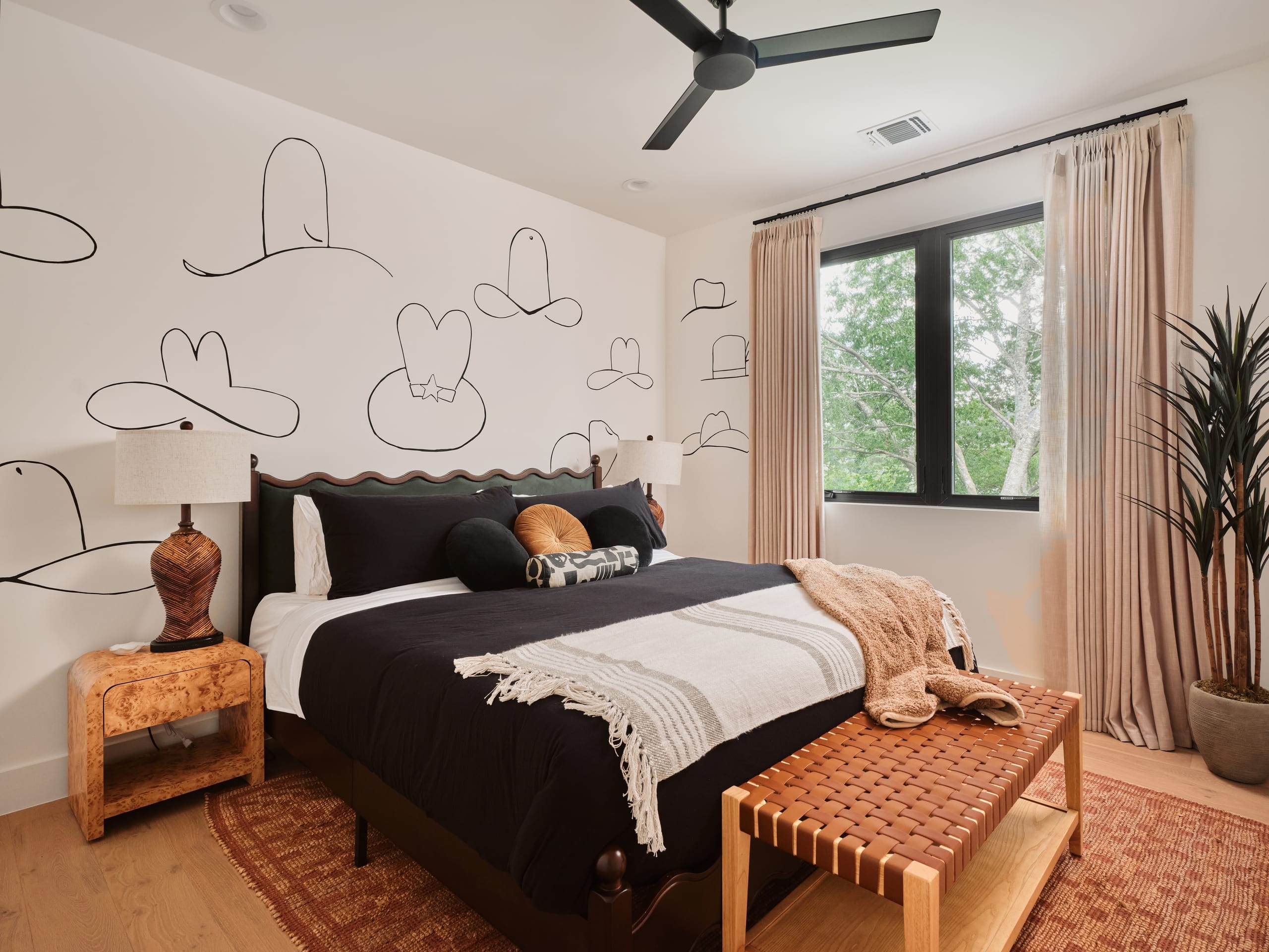The Lone Star Room with a king bed and mural wall