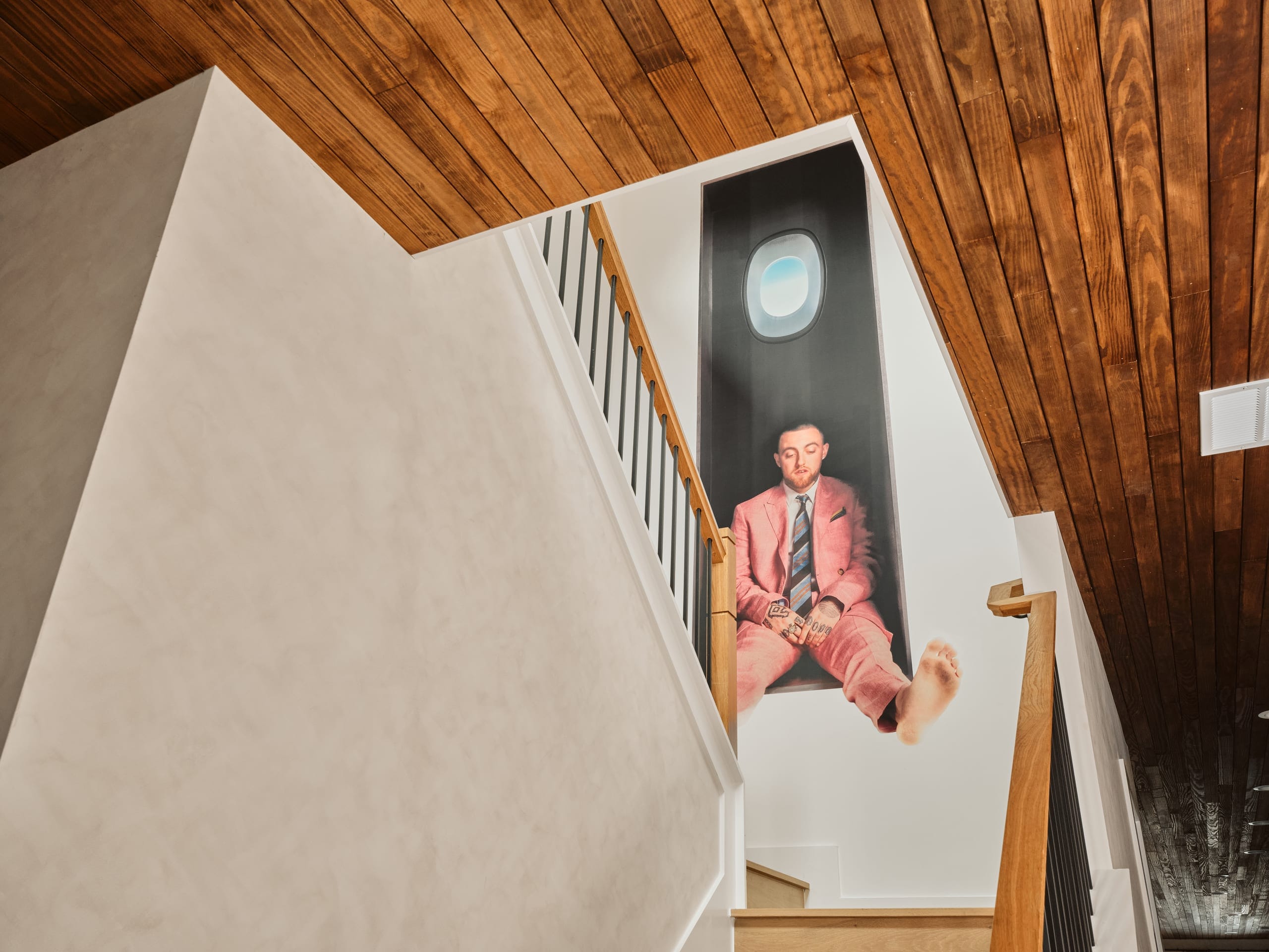 Slatted wood feature wall with portrait artwork