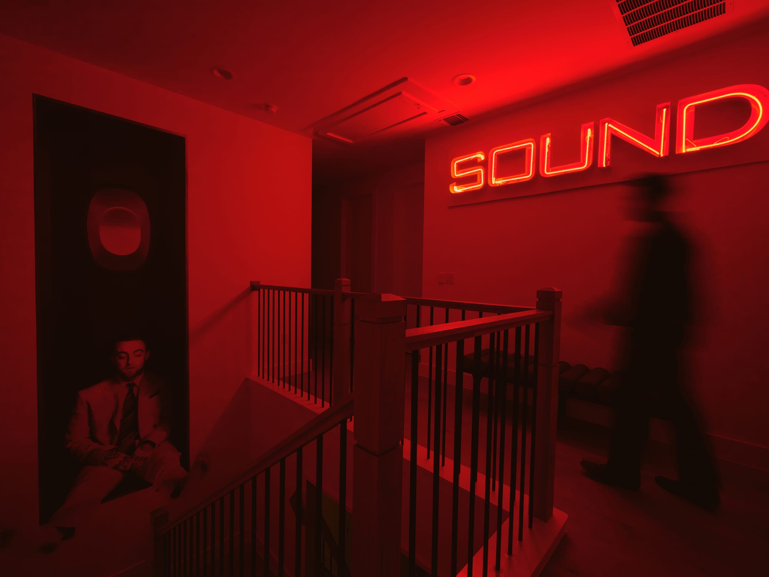 The SOUND sign glowing red in the vinyl room
